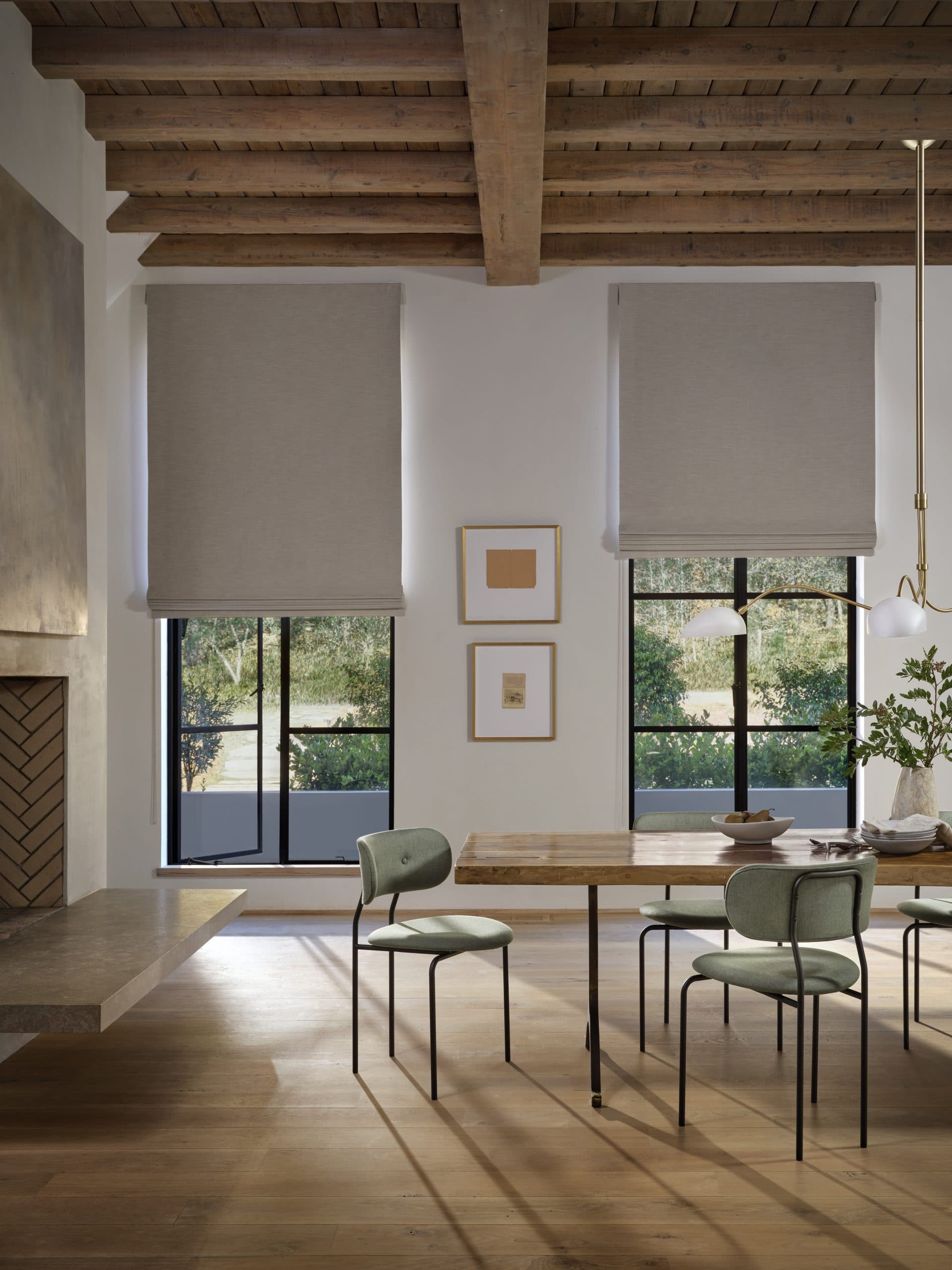 Woven wood and roman shades in dining room