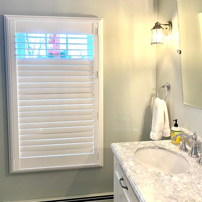 Composite plantation shutters in a Long Island bathroom