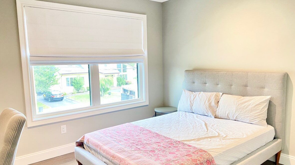 Hunter Douglas Bedroom Shades in Albertson, NY – Homestead Window Treatments Elegant Albertson bedroom with white Hunter Douglas shades filtering natural light.