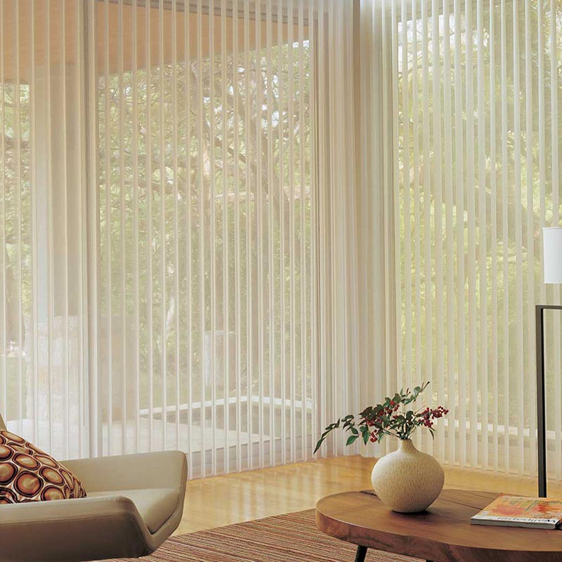 Elegant vertical blinds filtering sunlight in a modern Long Island living room.